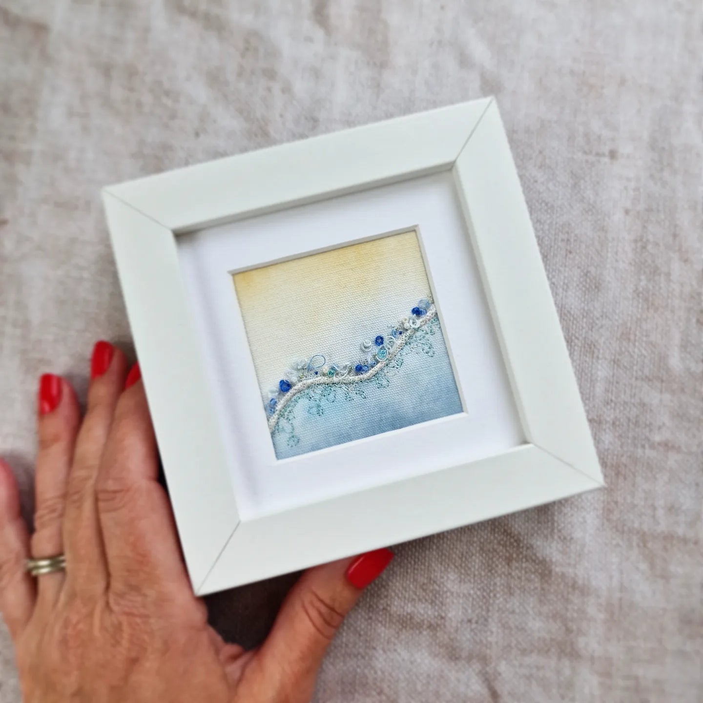 Framed beach embroidery