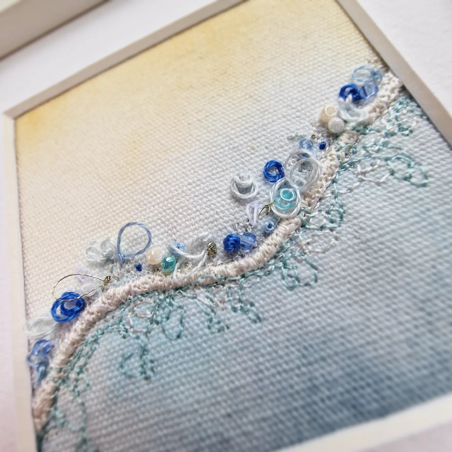 Framed beach embroidery